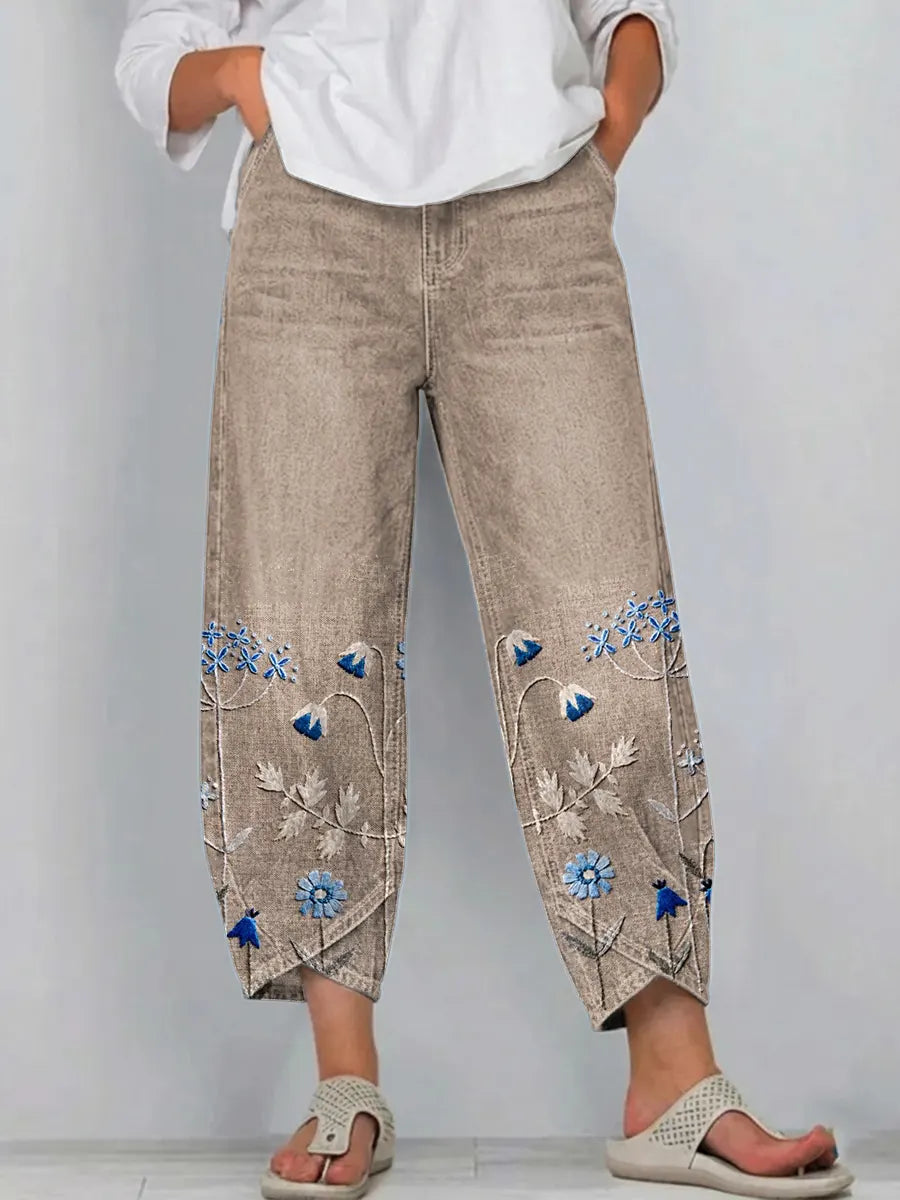 Pantaloni a gamba larga a vita alta con piega e tasche