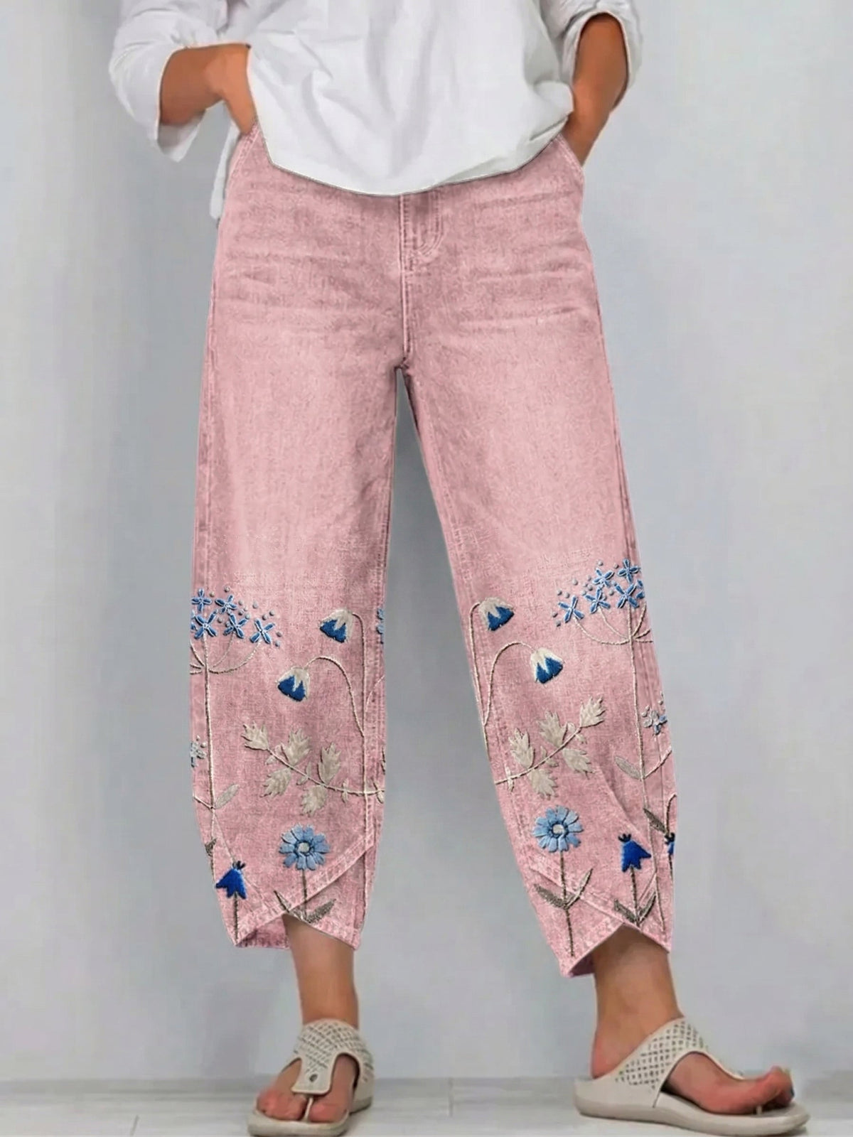 Pantaloni a gamba larga a vita alta con piega e tasche