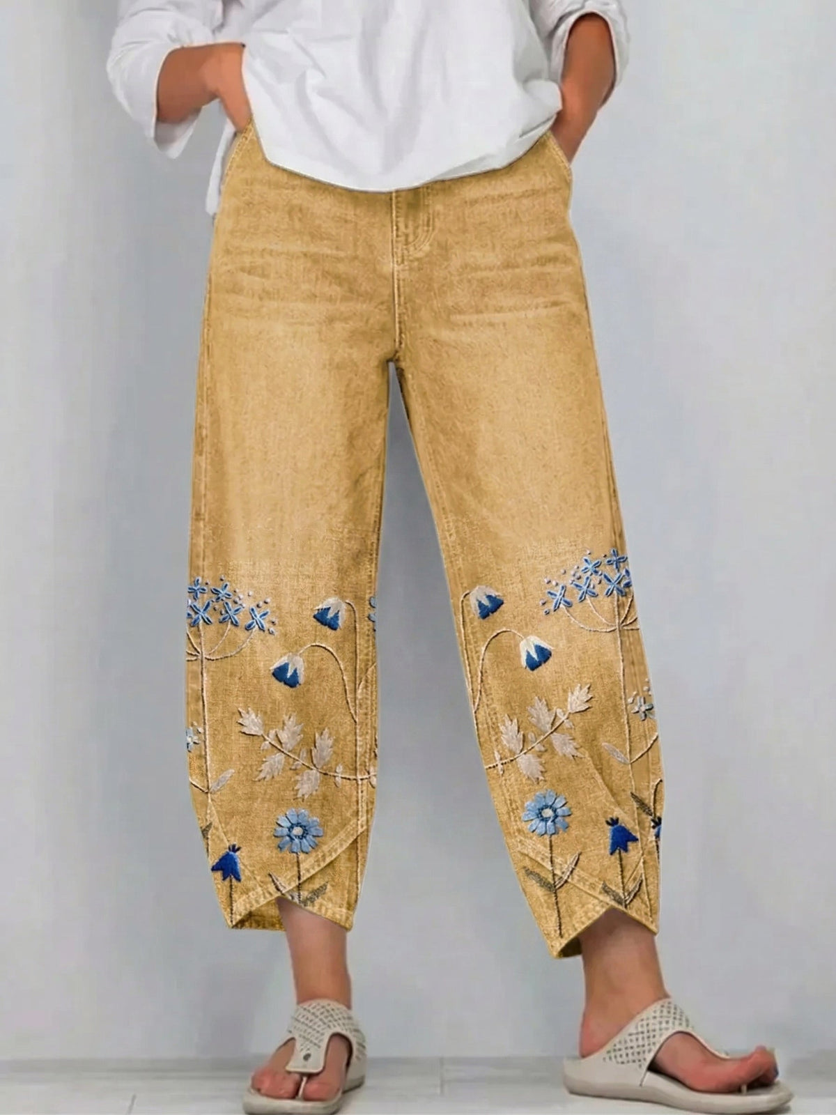 Pantaloni a gamba larga a vita alta con piega e tasche