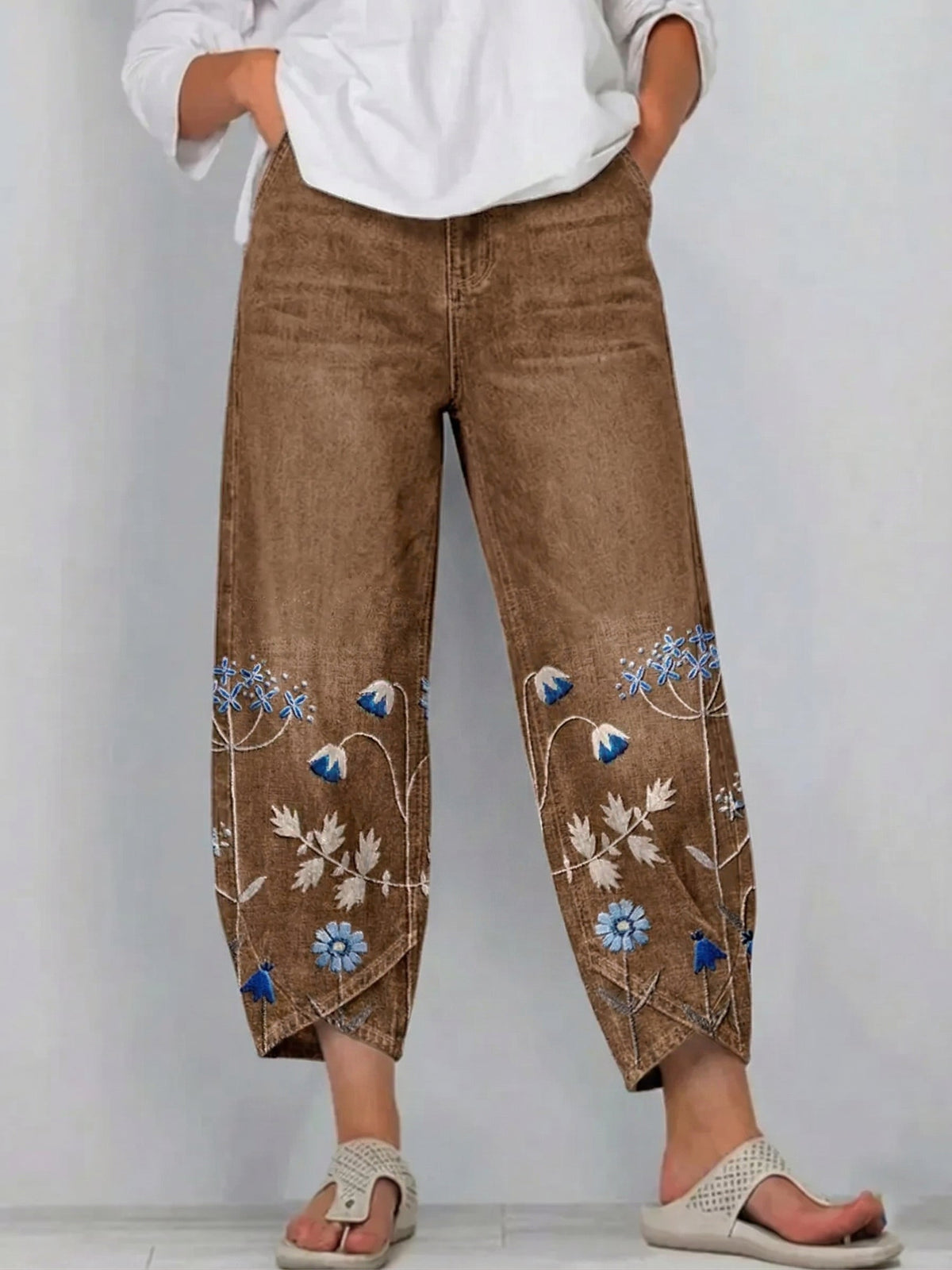 Pantaloni a gamba larga a vita alta con piega e tasche