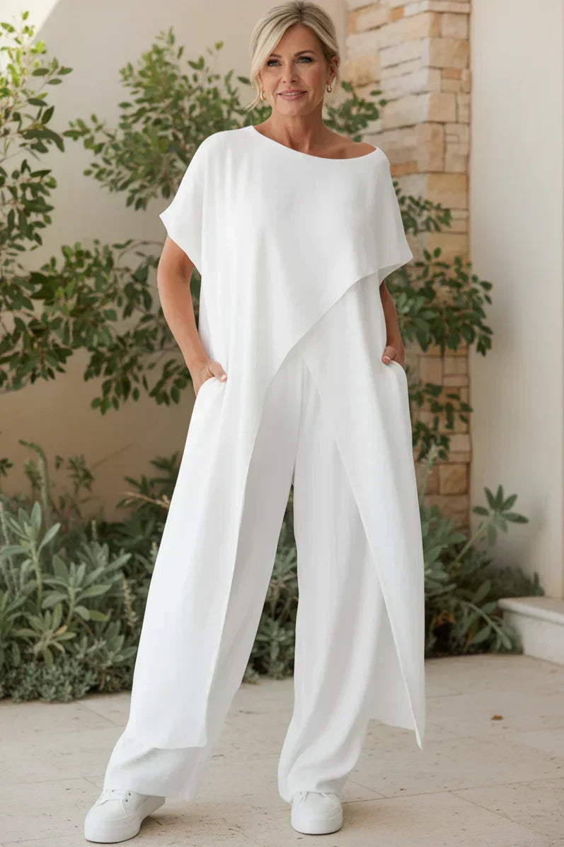 Completo con top asimmetrico e pantaloni a gamba larga