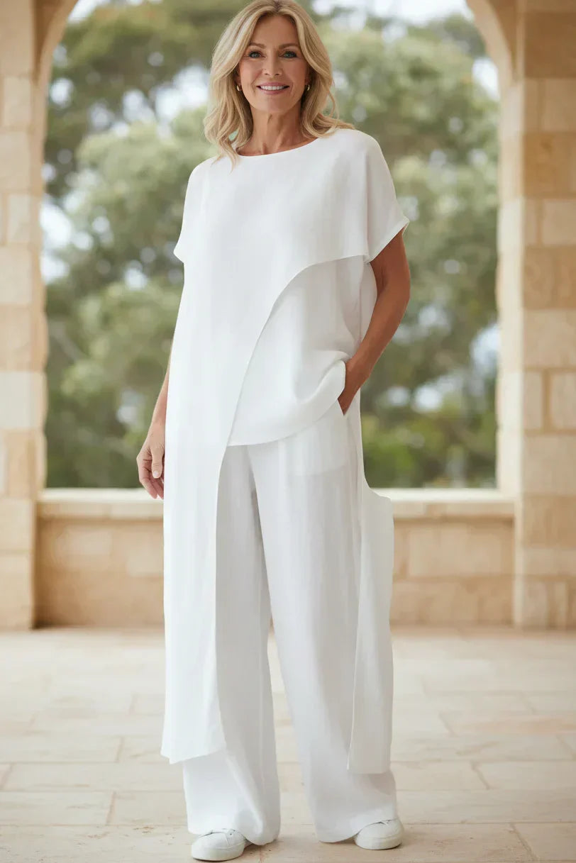 Completo con top asimmetrico e pantaloni a gamba larga