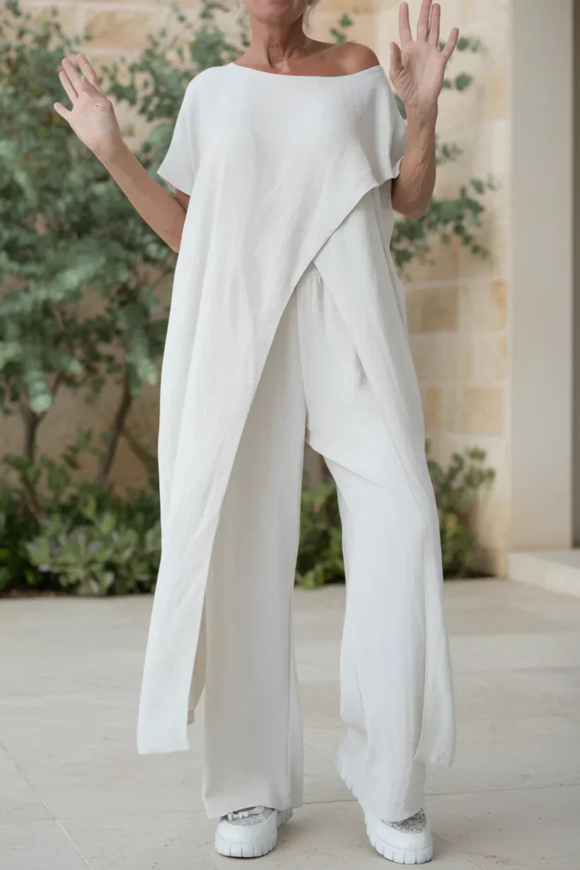 Completo con top asimmetrico e pantaloni a gamba larga