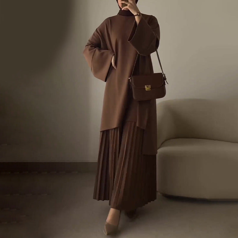 Completo con top oversize a maniche a campana e gonna plissé