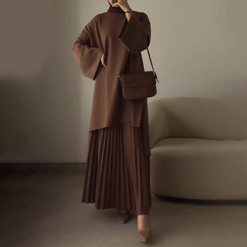 Completo con top oversize a maniche a campana e gonna plissé